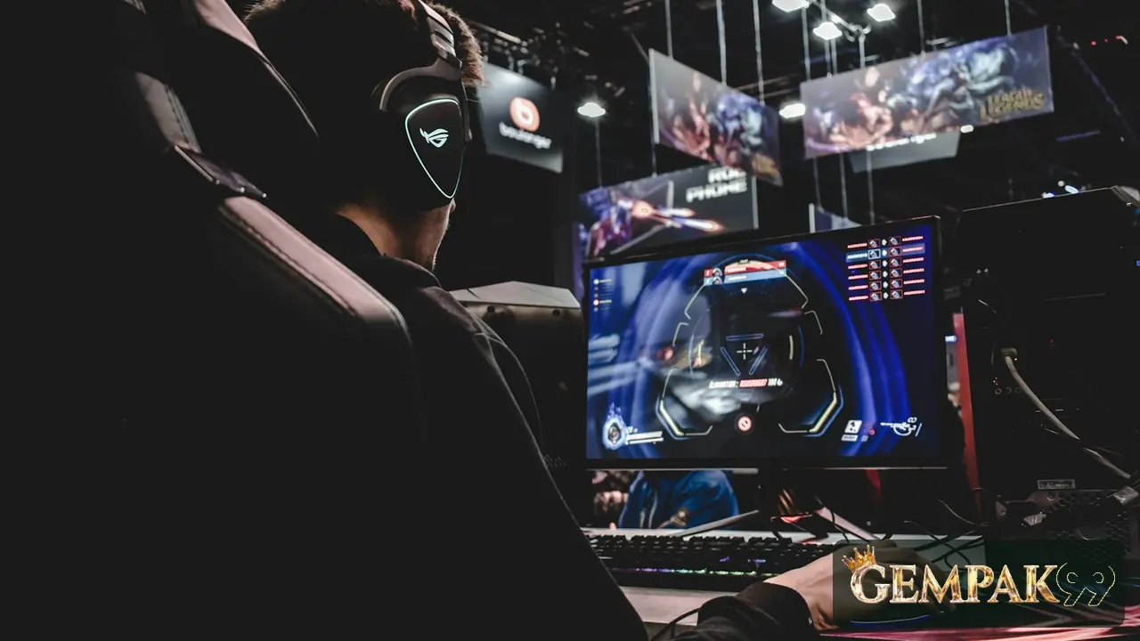 Player in a headset at an esports station, with the GEMPAK99 logo