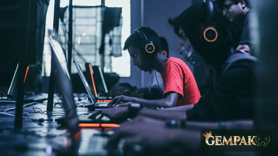 Esports players at a row of tournament PCs, with the GEMPAK99 logo